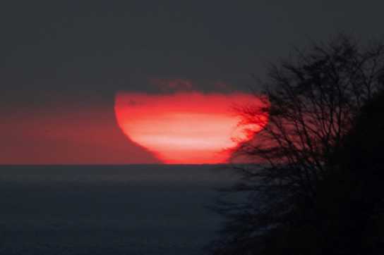 12 November 2022 - 07:27:22
Liquid sun. Twice a year (many will have heard this before) the sun rises over the sea as viewed from The Dartmouth Office. By moving to the extreme eastern spot in our garden it was just possible to see this beaut come up and with the optical illusion caused by refraction, or some such magical mystery, it appears to be very reluctant to leave the horizon.
---------------------------
Sunrise over the sea from Dartmouth